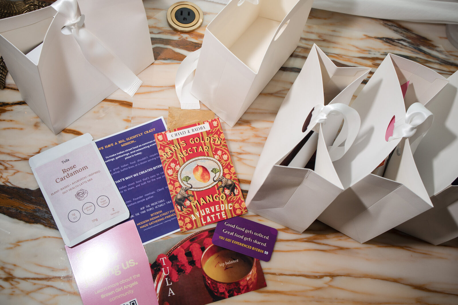 Welcome cards on the Brown Girls Chai & Chaat tables